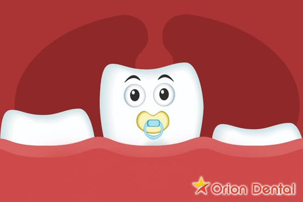 Stock image of a baby chewing on a teething toy