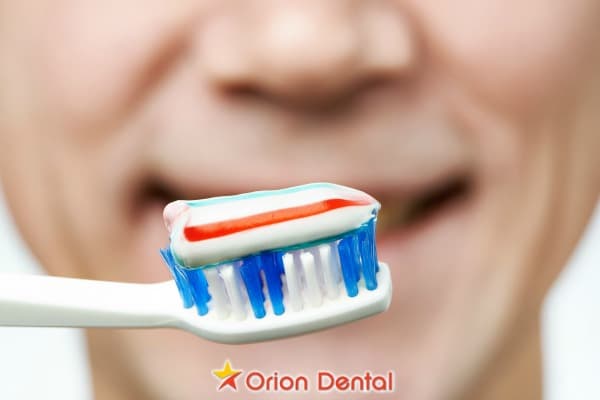 Stock image of toothpaste on a toothbrush