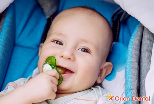 Stock image of a baby with a pacifier