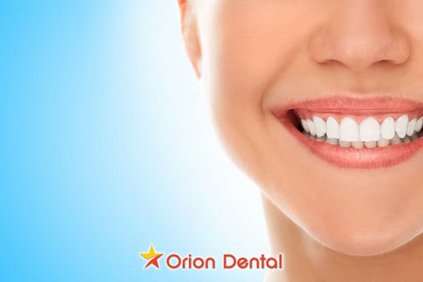 Stock image of a close-up of a smiling mouth and teeth