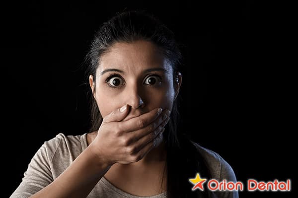 Stock image of a woman looking uncomfortable