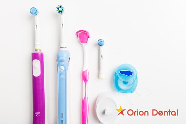 Stock image of a toothbrush, floss and other plaque-fighting tools