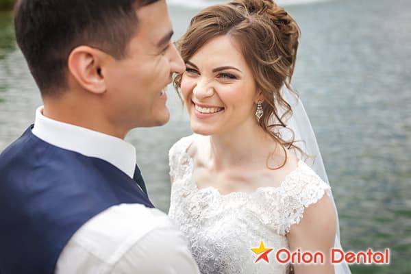 Stock image of a bride and groom smiling
