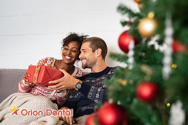 Stock image of a person smiling during the holiday season