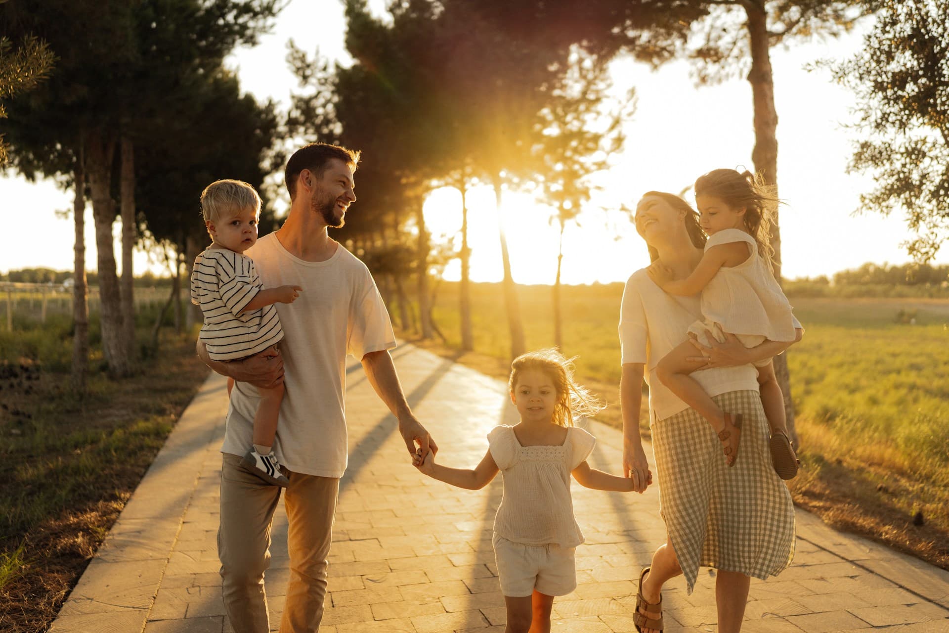 Stock image of a family outdoors in golden evening light