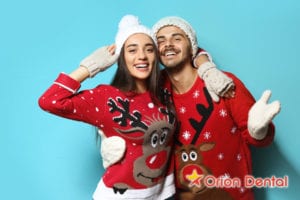 Couple in Christmas sweaters