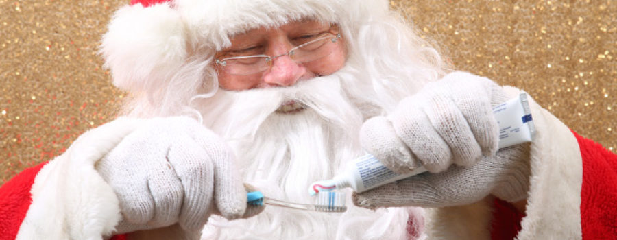 Santa with toothpaste and toothbrush