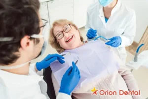 Smiling patient in dentist chair