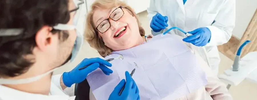 Smiling patient in dentist chair